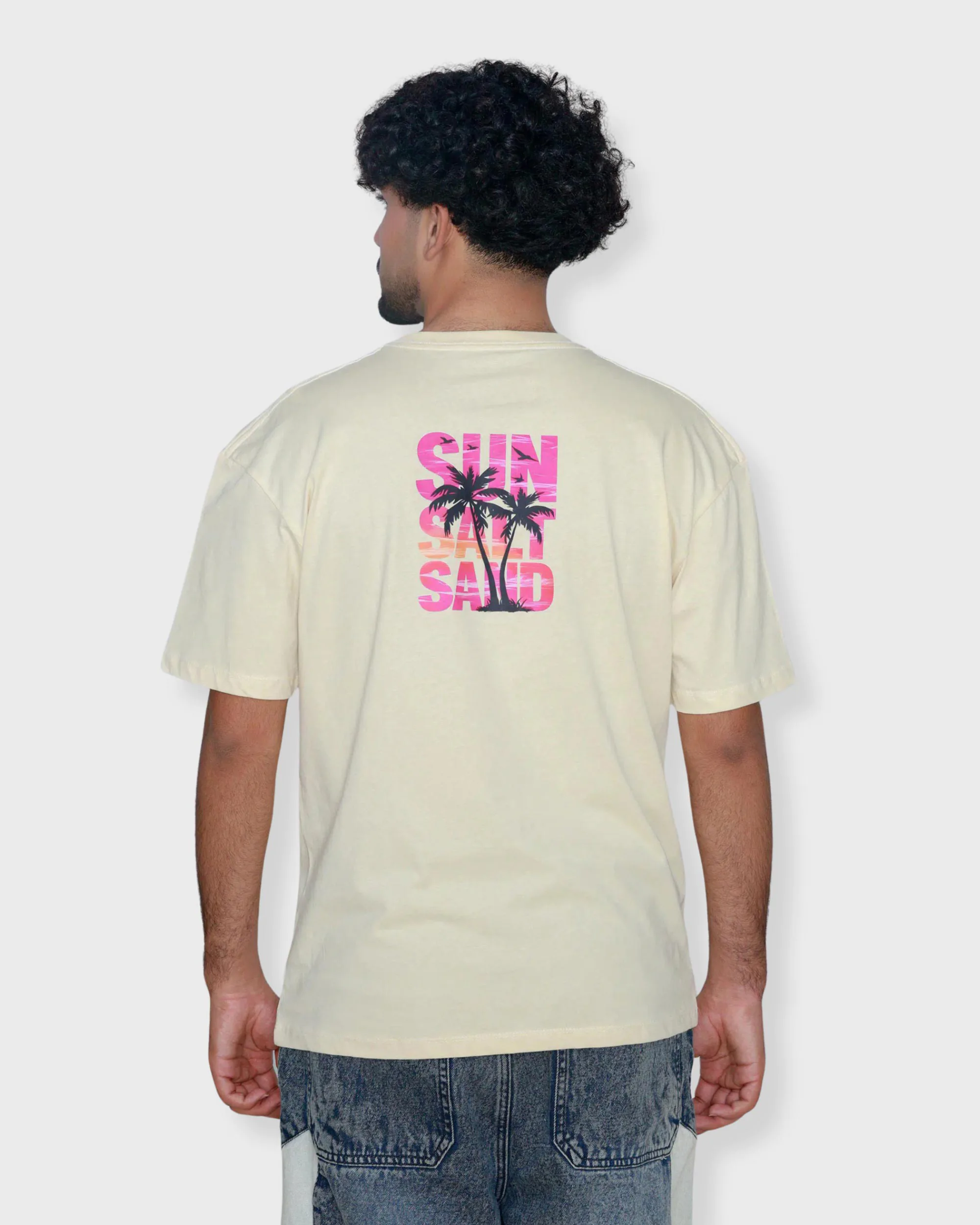 Cream oversized box fit t-shirt with colorful “Sun Sand Salt” graphic print on center back