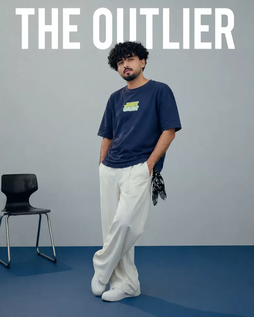 Navy blue oversized box fit t-shirt with “Just Sayin’” front print styled in editorial setup